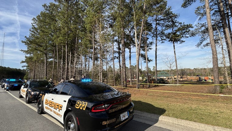 The Newton County Sheriff’s Office investigates a shooting at Denny Dobbs Park, across the street from Oak Hill Elementary School along Highway 212 on March 19, 2025.