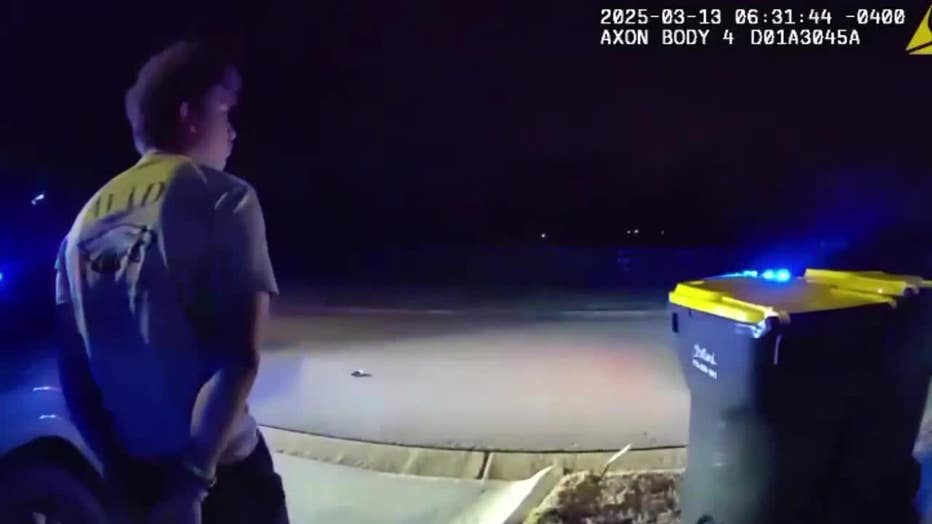 Robert Christopher Mayfield, a 17-year-old high school student, was escorted by Coweta County sheriff's deputies after being arrested on March 13, 2025.