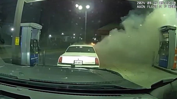 Dashcam: Stockbridge officer pushes burning car away from fuel pumps
