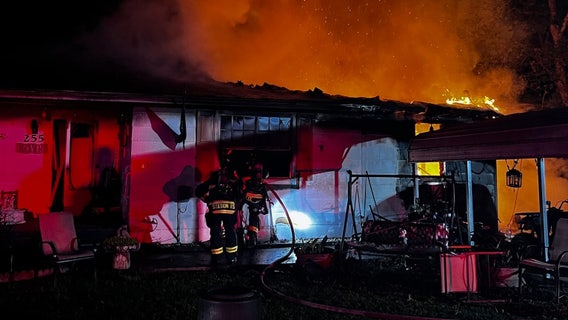 Woman killed in massive fire at Jackson County home, 2 men rushed to hospital