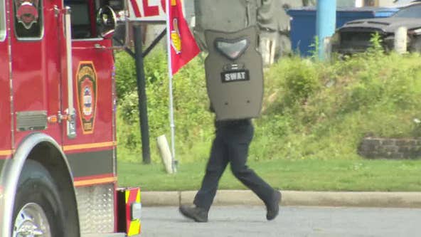Multiple people detained in shooting; Marietta police, SWAT surround auto shop