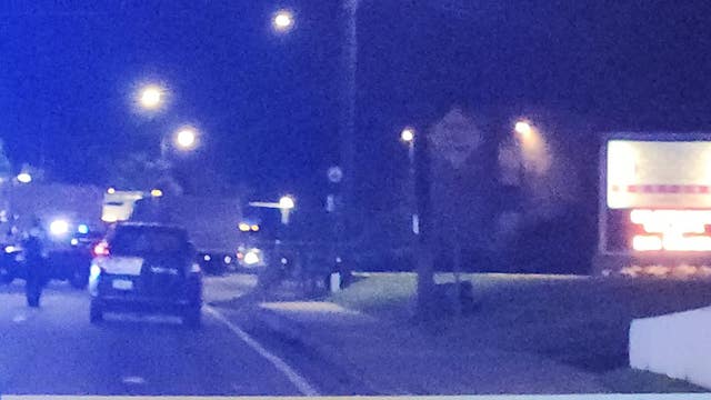 Woman lying in the road hit, killed by car, police say