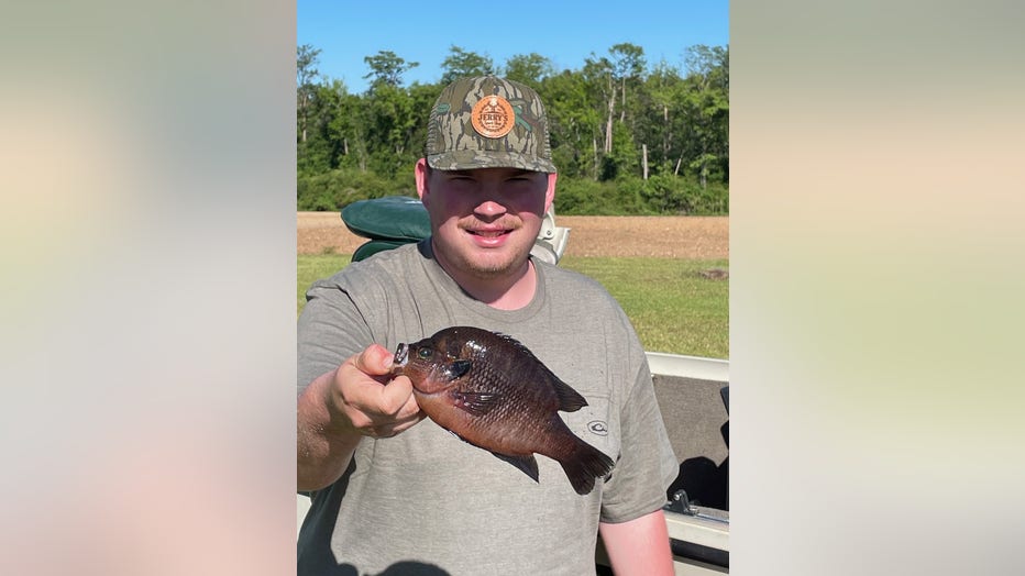 Wesley Daniels of Pearson shows off a spotted sunfish weighing 12 ounces he caught on April 15, 2025.