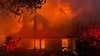 Photos: Massive blaze engulfs log cabin, firefighters faced challenges