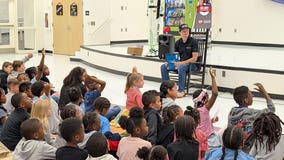 NASCAR driver's 'need for read' inspires Henry County students