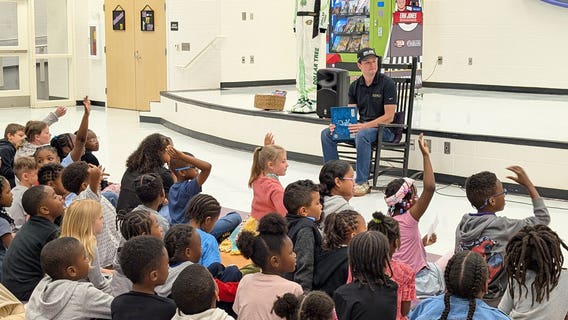 NASCAR driver's 'need for read' inspires Henry County students