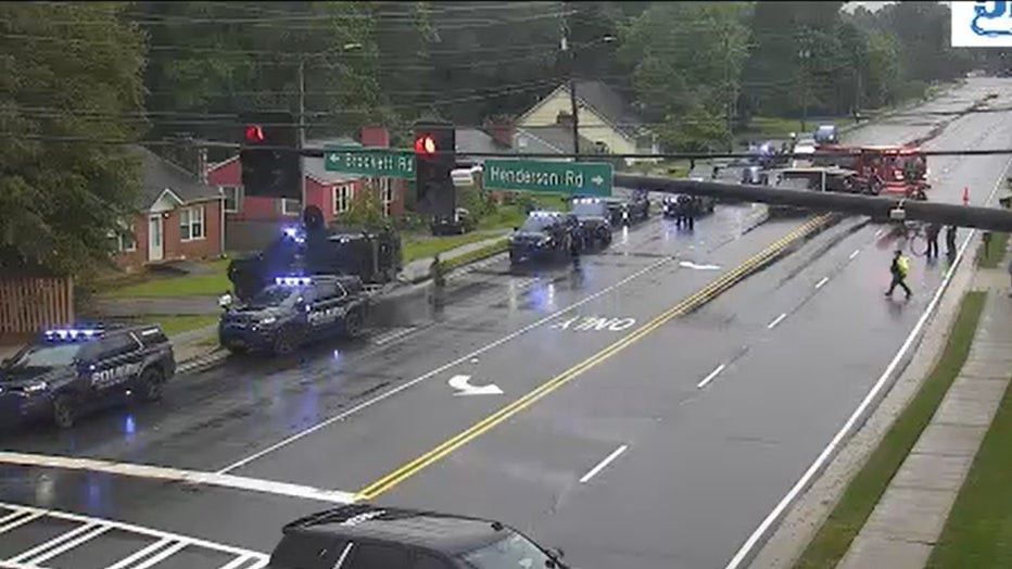 Police swarm the area of LaVista Road at Henderson Road in Tucker on May 29, 2025.