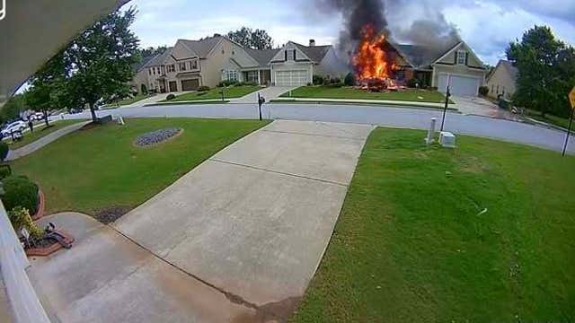 Photos: Car crashes into Union City Home, ignites fire