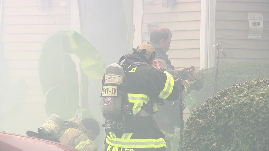 Firefighters battle a blaze at a townhome along Shadow Walk Lane in Tucker on June 27, 2025.