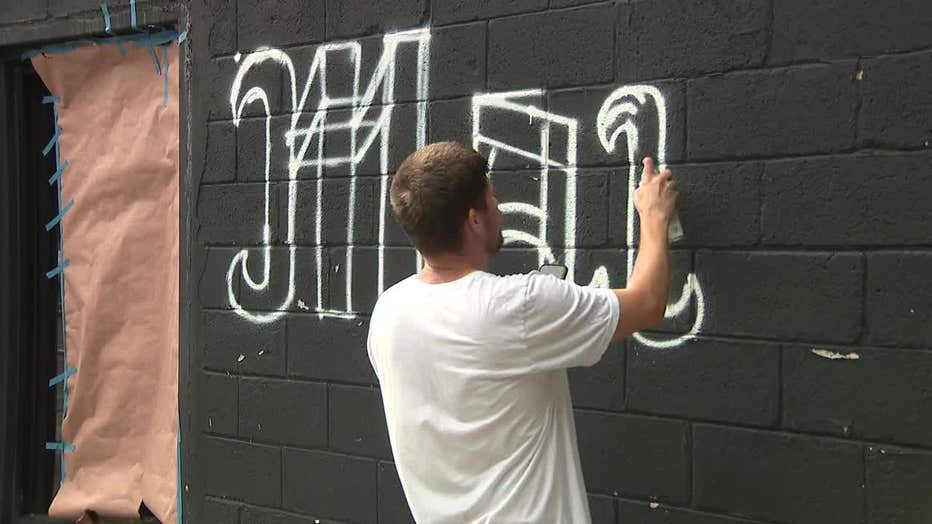 A mural being painted to honor Mariam Abdulrab outside Sunset, formerl Revry, in Atlanta on June 10, 2025.