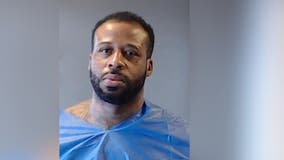 Man arrested in connection with body found in burning car in Ellenwood