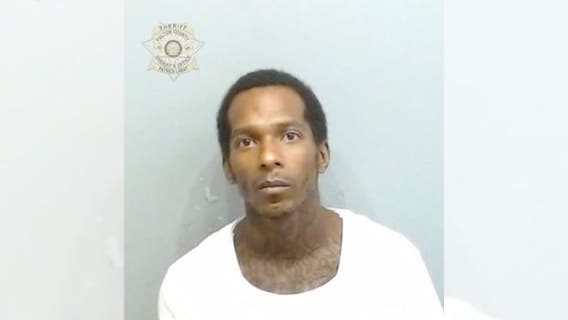 Man charged in 2 Atlanta murders after returning to crime scene