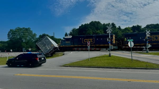 Train hits semi-truck in Conyers; road prohibited tractor-trailers