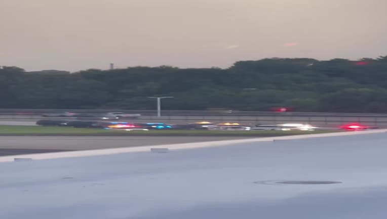 A passenger aboard a flight ready to take off from Hartsfield-Jackson Atlanta International Airport captured the police response following a security breach along the fence near Leslie Drive and North Loop Road on July 9, 2025.