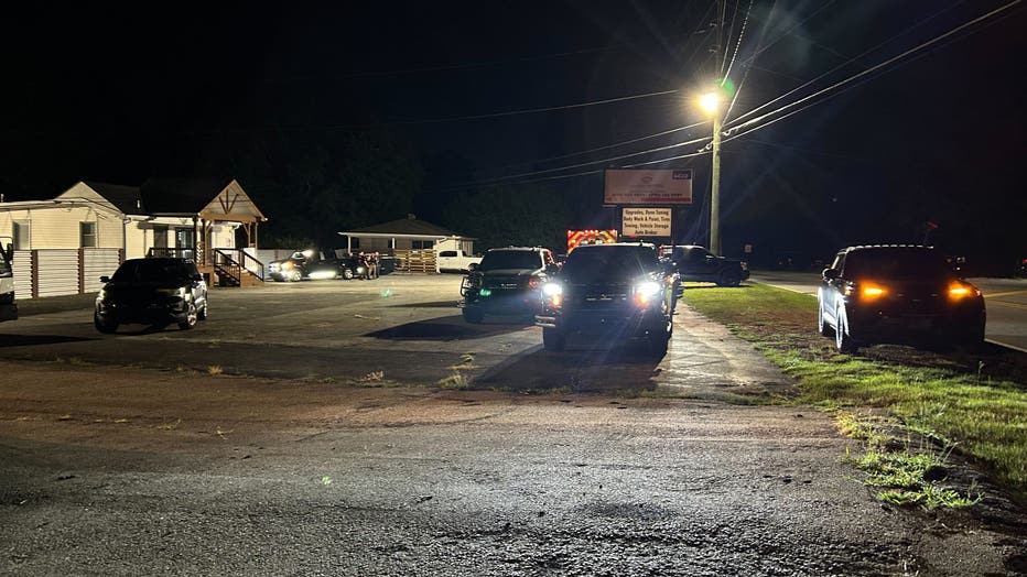 Law enforcement officials surround the scene of an officer-involved shooting and SWAT standoff along Eugenia Place off Austell Powder Springs Road in Cobb County on July 31, 2025.