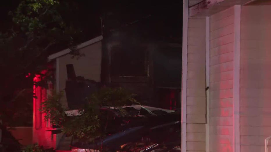 Firefighters work to hit hot spots after a lightning strike sparked a fire at the Redan United Methodist Church located along S. Stone Mountain Lithonia Road in Lithonia on July 1, 2025.