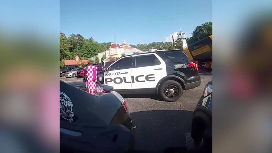 Marietta police officers rescued two dogs from a hot car parked at Six Flags White Water in Marietta on July 5, 2025.