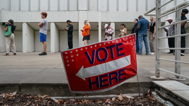 Judges debate Georgia's ban on giving snacks, water to voters