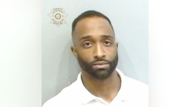 Former Atlanta officer arrested on rape allegation over massage appointment