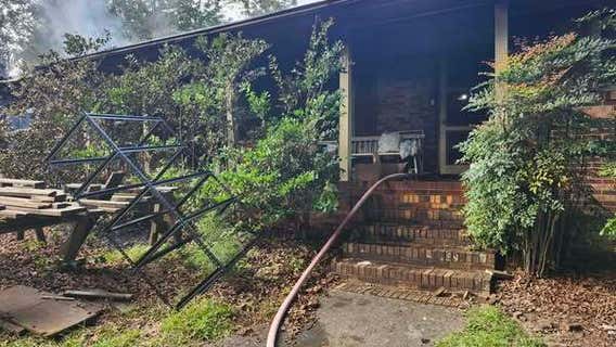 Woman rescued from Snellville house fire dies