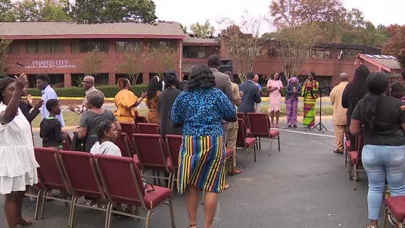 Austell church holds outdoor service after fire destroys building