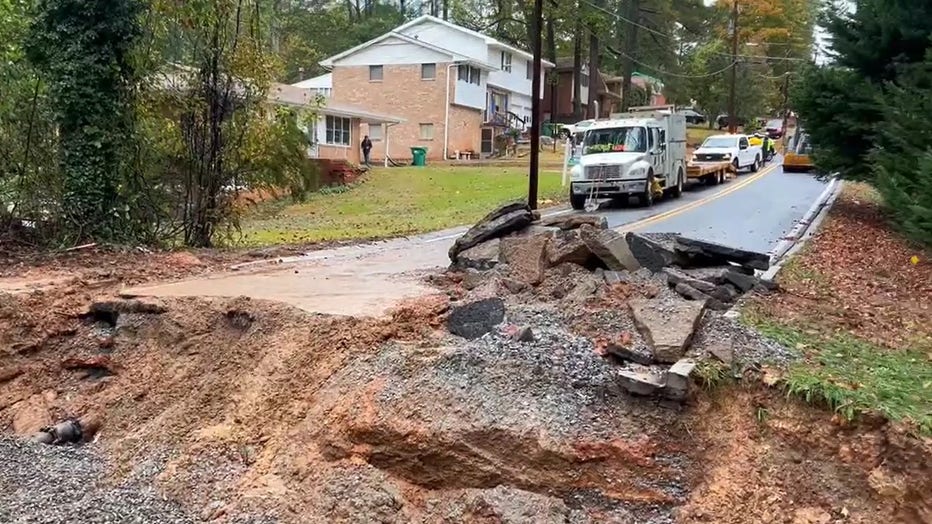 A washed-out section of Longleaf Drive caused by a broken six-inch waterline forces road closure at the intersection of Pine Creek Road in Forest Park on Monday, Oct. 27, 2025.