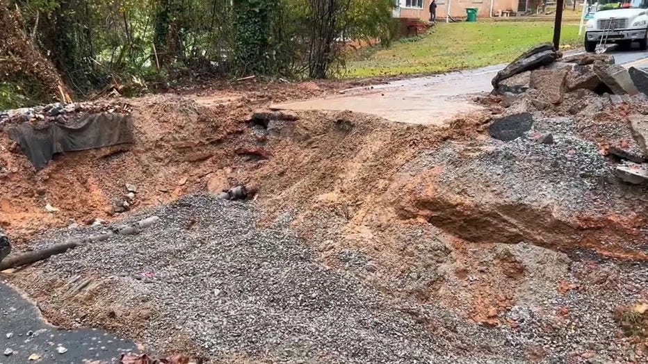 A washed-out section of Longleaf Drive caused by a broken six-inch waterline forces road closure at the intersection of Pine Creek Road in Forest Park on Monday, Oct. 27, 2025.