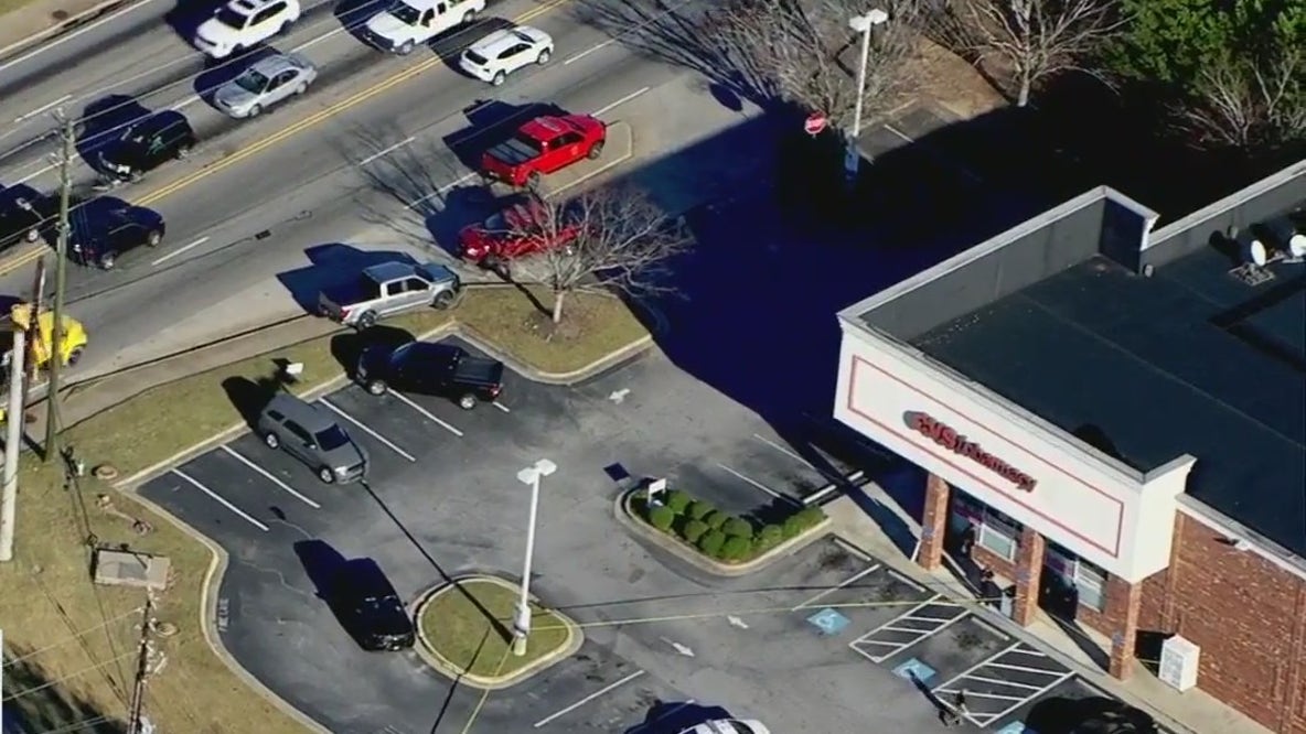 Woman shot in the head at Loganville CVS; person of interest in custody