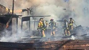 Strong winds rekindle Flowery Branch house fire overnight