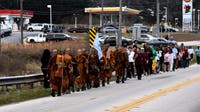 Hundreds gather in LaGrange to meet Buddhist monks on peace walk