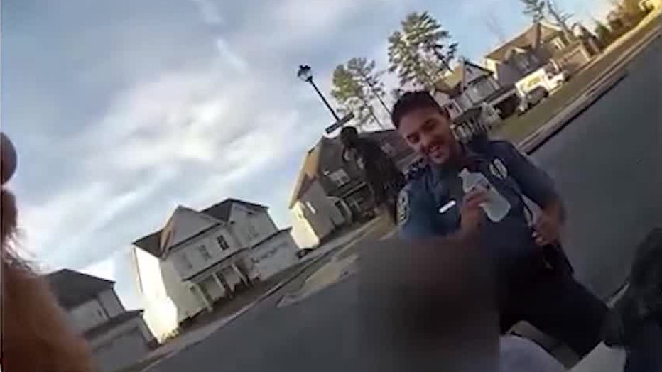 First responders check on the five-year-old boy moments after he was safely pulled from a storm drain at Peachtree Ridge Park on November 15, 2025.