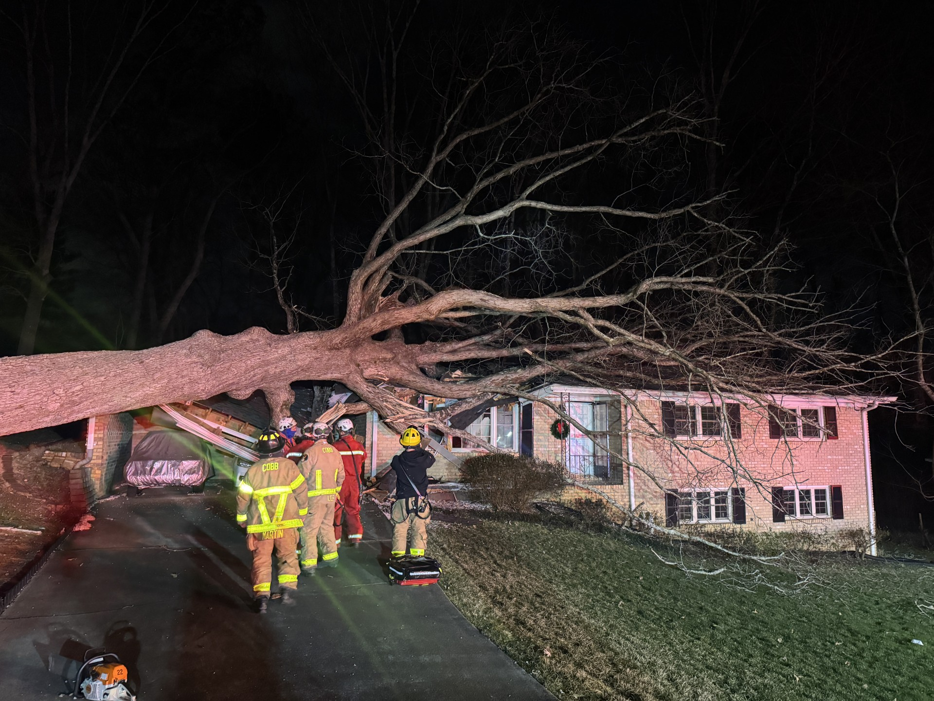 Tree falls on Cobb County home trapping 2
