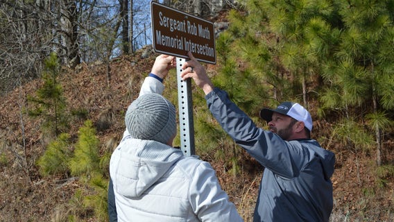 Intersection renamed for retired cop who died after Cumming Christmas parade