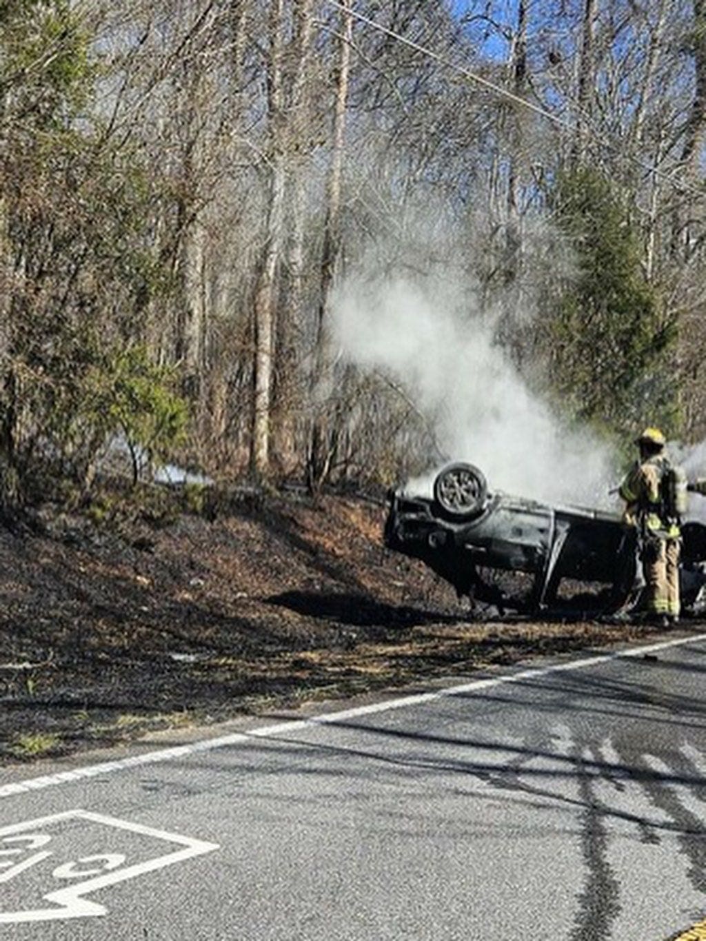 2 injured after car rolls, hitting power pole, sparking grass fire