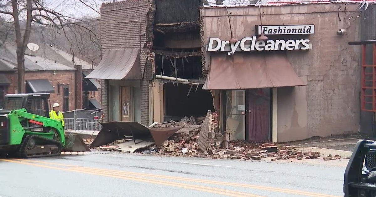 Car crashes into Atlanta dry cleaners causing partial building collapse