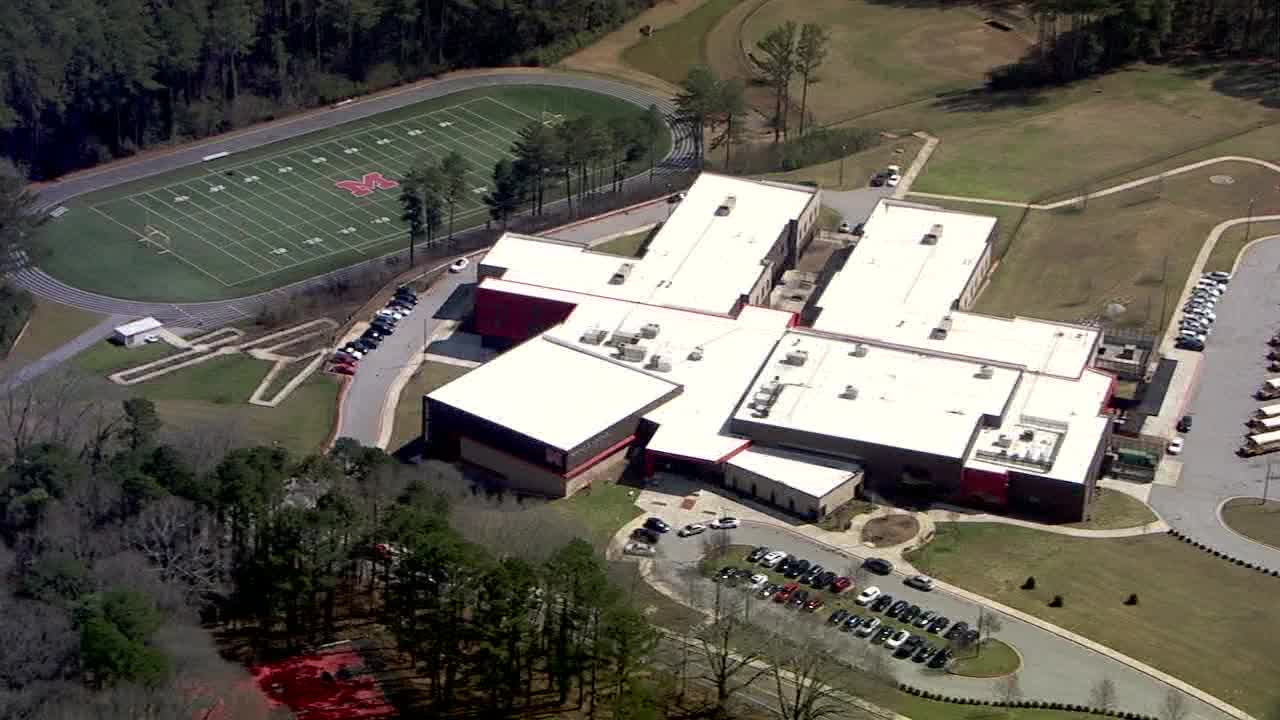 Man runs to McNair Middle School after being shot, officials say