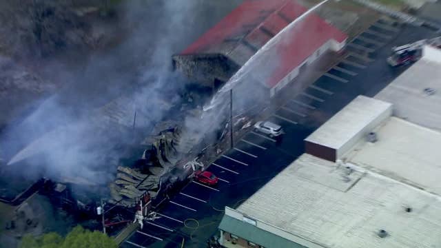 Firefighters battle warehouse fire in Loganville