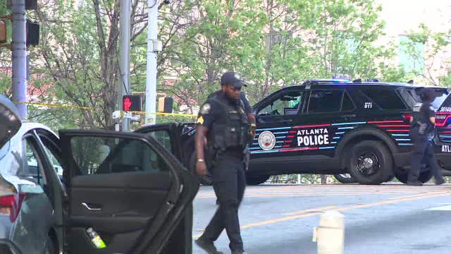 Atlanta delivery driver shot while shielding teen from gunfire