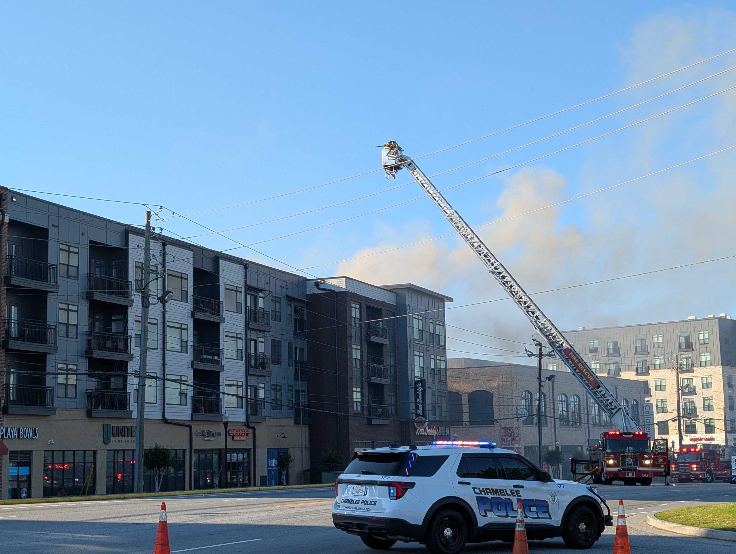 Road closed as crews battle fire at Chamblee complex