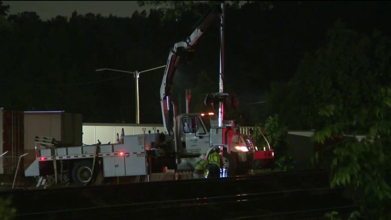 Train collision with car-carrying truck closes McDonough intersection