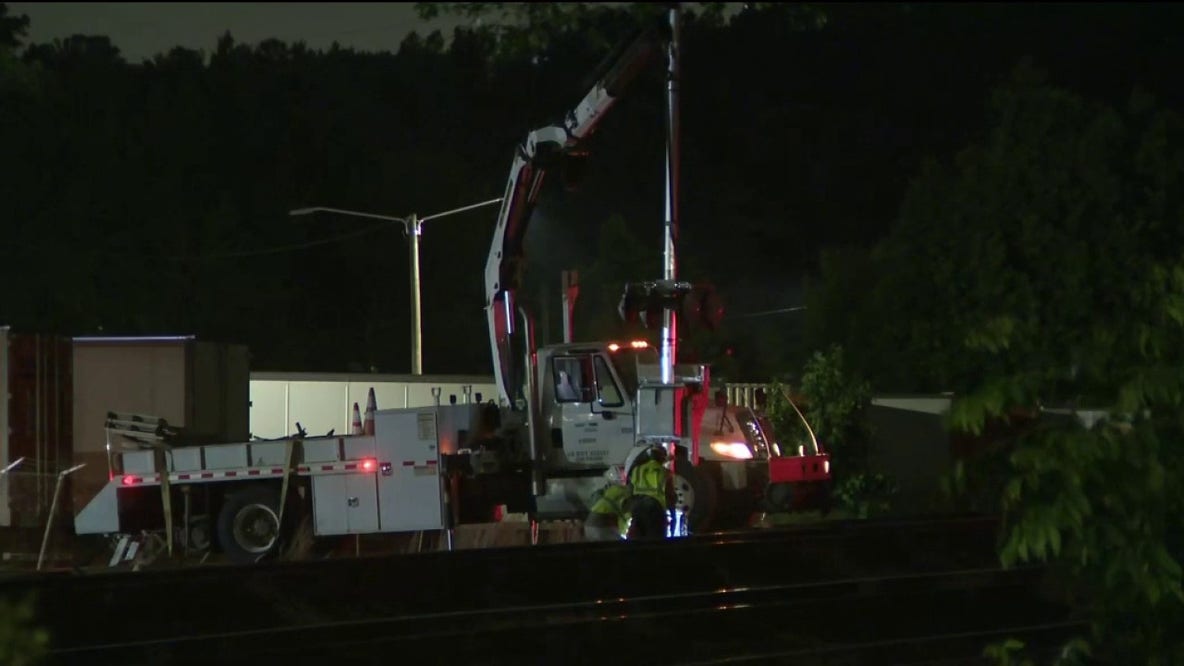 Train collision with car-carrying truck closes McDonough intersection