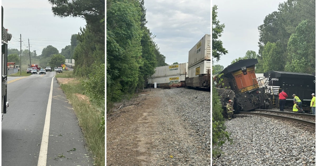Train derails after crash with tractor-trailer in Hall, crossings closed