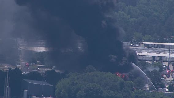 Crews battle two-trailer blaze in DeKalb County near I-285 and I-675