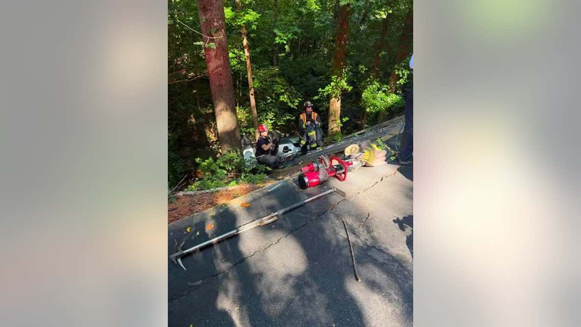 Driver saved after vehicle goes down Sandy Springs embankment