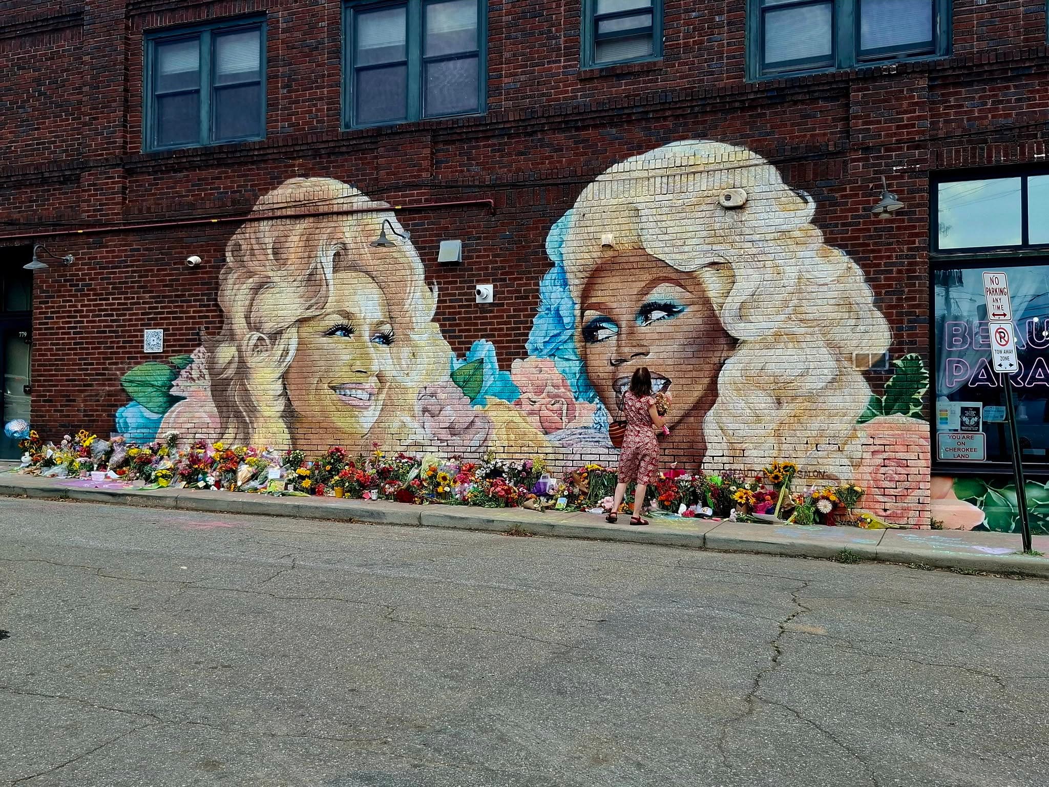 Dolly Parton, RuPaul mural becomes gathering place for mourning fans
