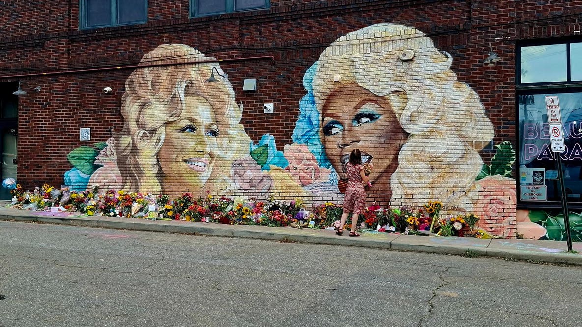 Dolly Parton, RuPaul mural becomes gathering place for mourning fans