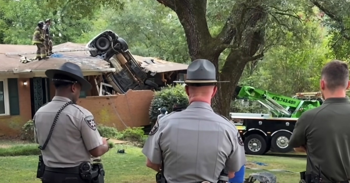 Driver dies after car launches into roof of Middle Georgia home