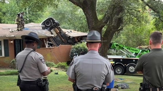 Driver dies after car launches into roof of Middle Georgia home