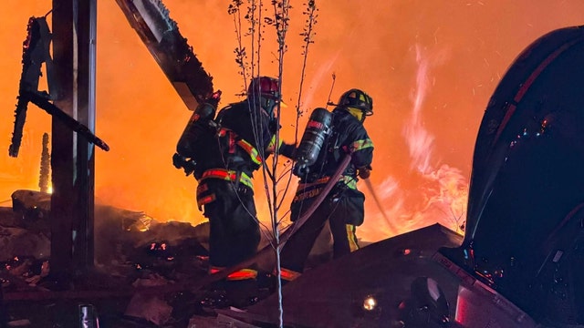 Fallen tree blocks firefighters responding to fully-involved house fire