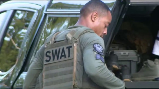 Explosives end tense 14-hour southwest Atlanta standoff